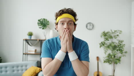 man looking surprised in retro sport outfit