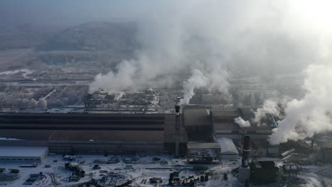 aerial view of steelworks in industrial zone. factory chimneys smoking. heavy industry from above.