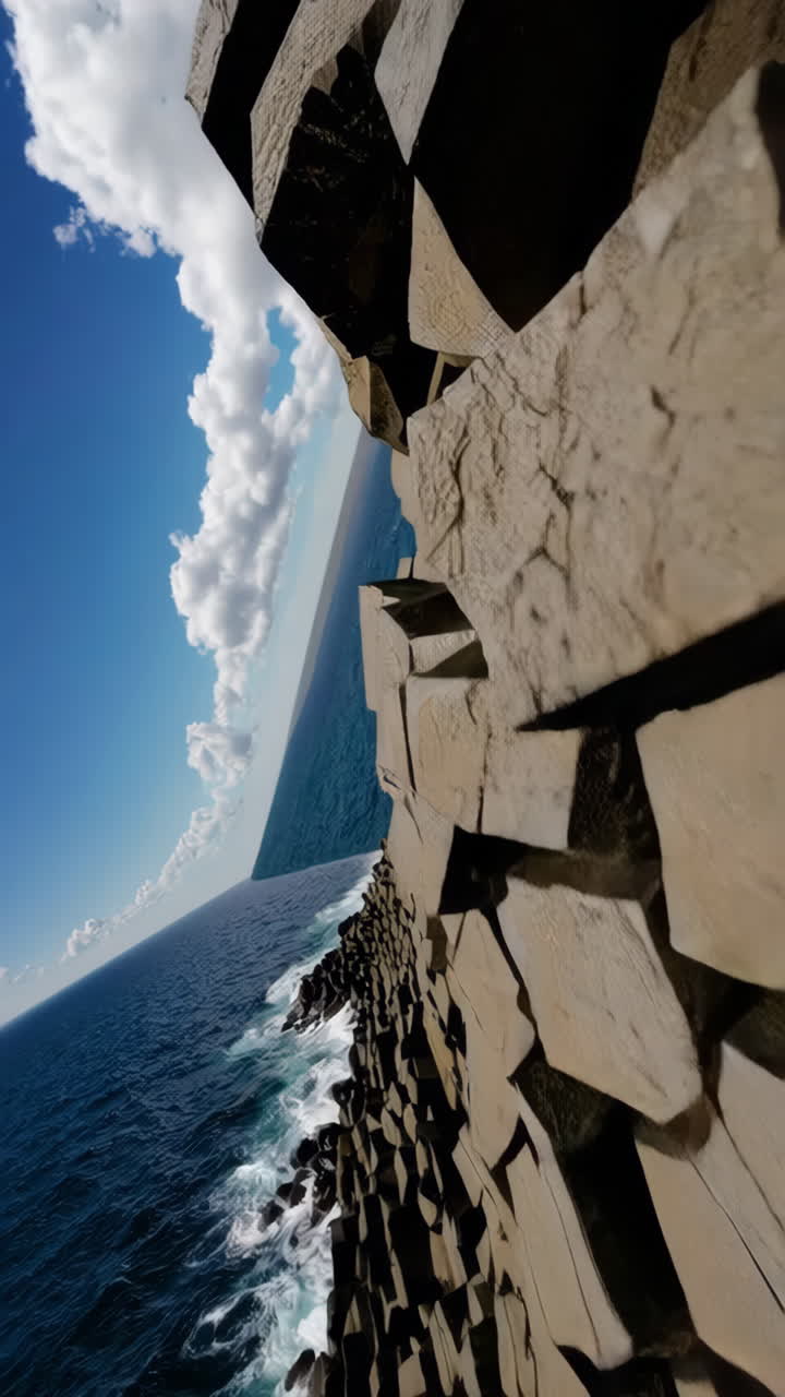 Abstract Composition of Stacked Geometric Forms Against a Blue Sky