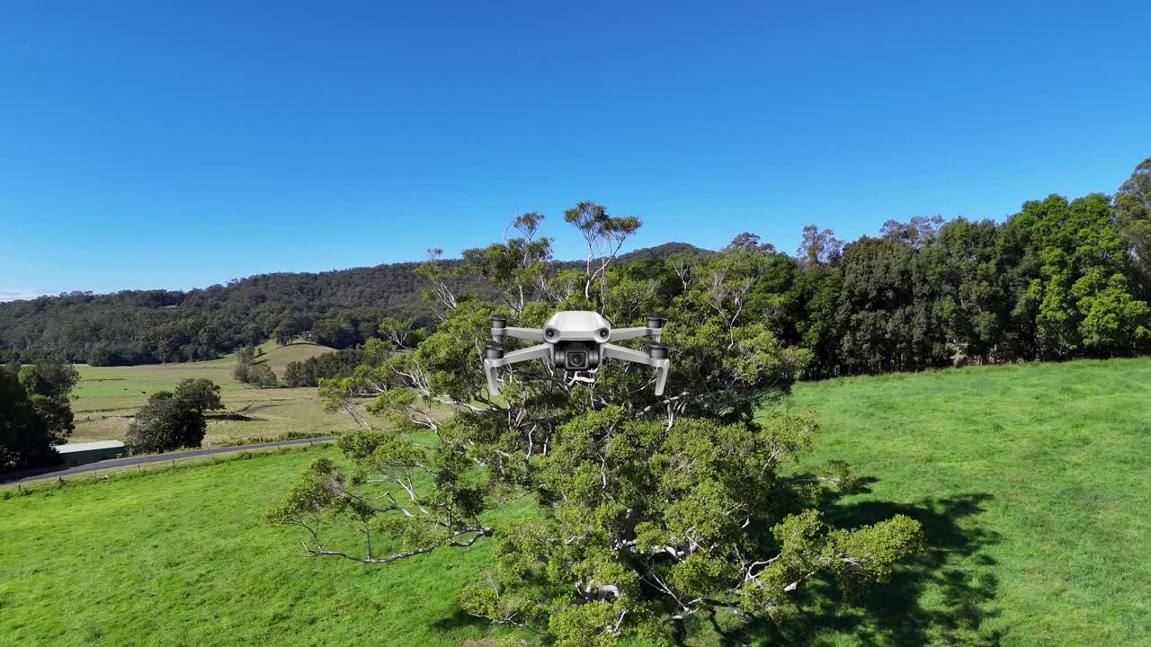 Aerial animation of a drone navigating through a verdant landscape with trees, showcasing smooth transitions and vibrant colors