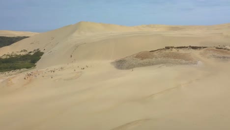 Aerial-tracking-of-the-Giant-Sand-Dunes-in-Northland,-New-Zealand