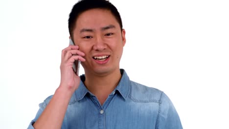 asian happy man having a phone call