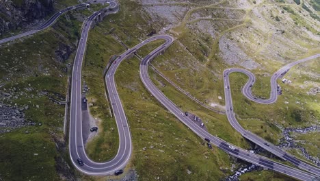 Beautiful-winding-road-in-the-heart-of-the-Carpathian-Mountains,-captured-with-a-drone