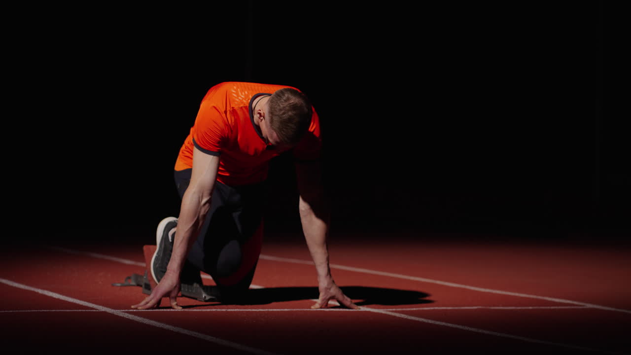 velocista en el bloque de salida