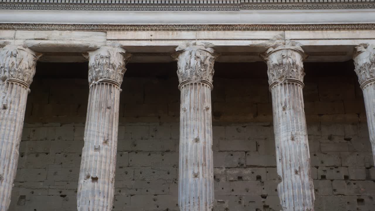 Old stone columns with detailed capitals in Rome near the Pantheon, Italy