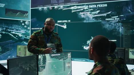 Military-officer-leads-cybersecurity-efforts-in-a-high-tech-control-center