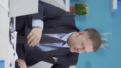 vertical video of home office worker man is angry and furious