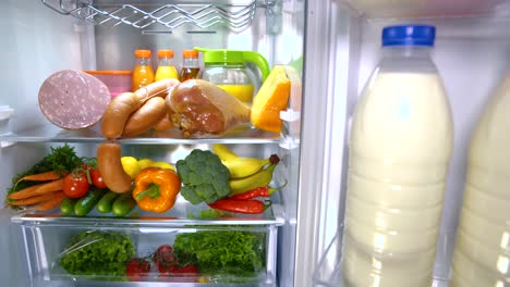 Open-refrigerator-filled-with-food