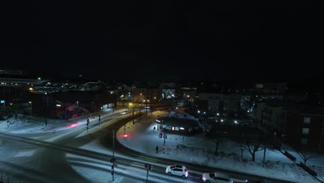 City-vehicles-come-and-go-at-street-intersection-in-night-time-lapse