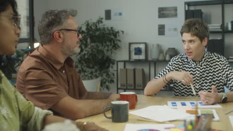 female team lead talking to coworkers on meeting