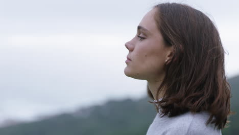 portrait of happy woman looking up smiling enjoying freedom outdoors exploring wanderlust contemplating spiritual journey in countryside breathing fresh air feeling positive