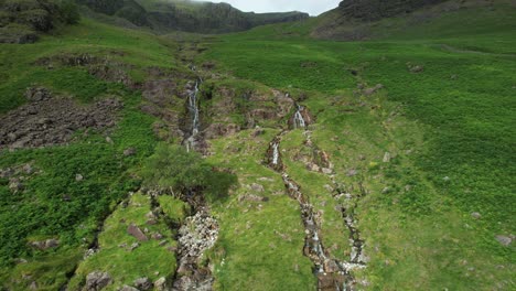 Aerial-view-of-Moss-Force-waterfall,-Buttermere,-Lake-District,-UK