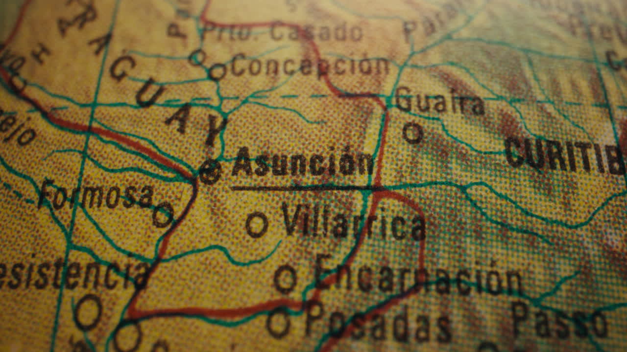 Close-up of a world map highlighting Asunción, Paraguay.