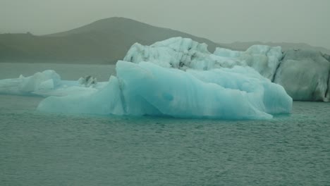 Pan-of-beautiful-blue-Iceberg-on-Icelandic-lake