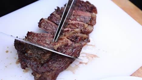 slicing a grilled steak