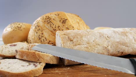 various bread loaves with knife