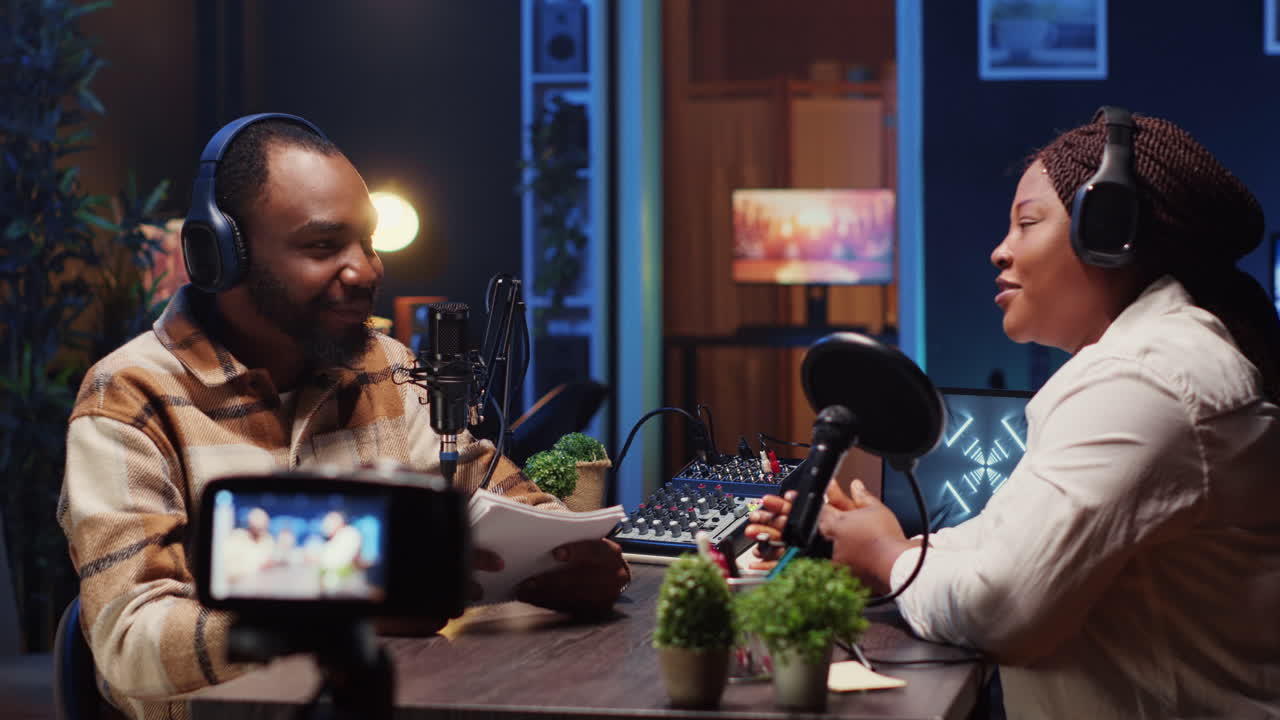 how host making woman laugh during podcast filmed with professional gear