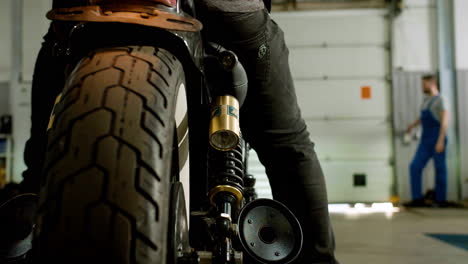 back view of man riding a motorcycle