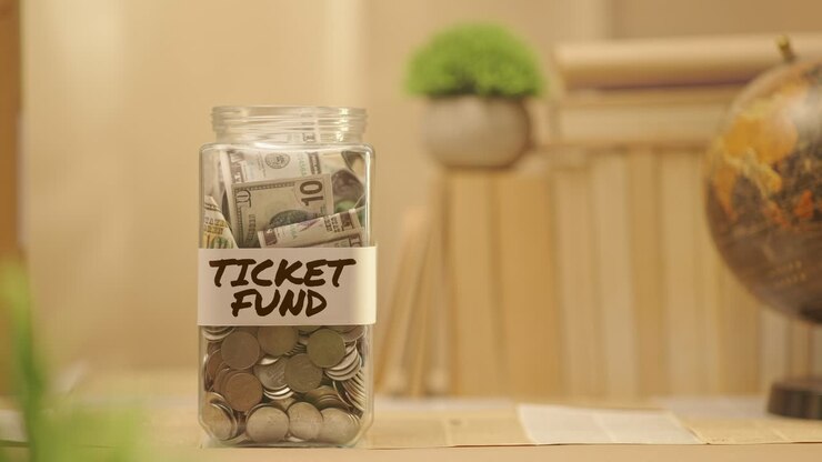 PERSON SAVING MONEY FOR TICKET FUND