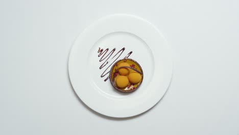 elegant dessert tart with orange coulis