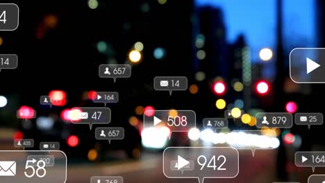 Animation-of-social-media-icons-and-numbers-over-road-traffic-and-cityscape