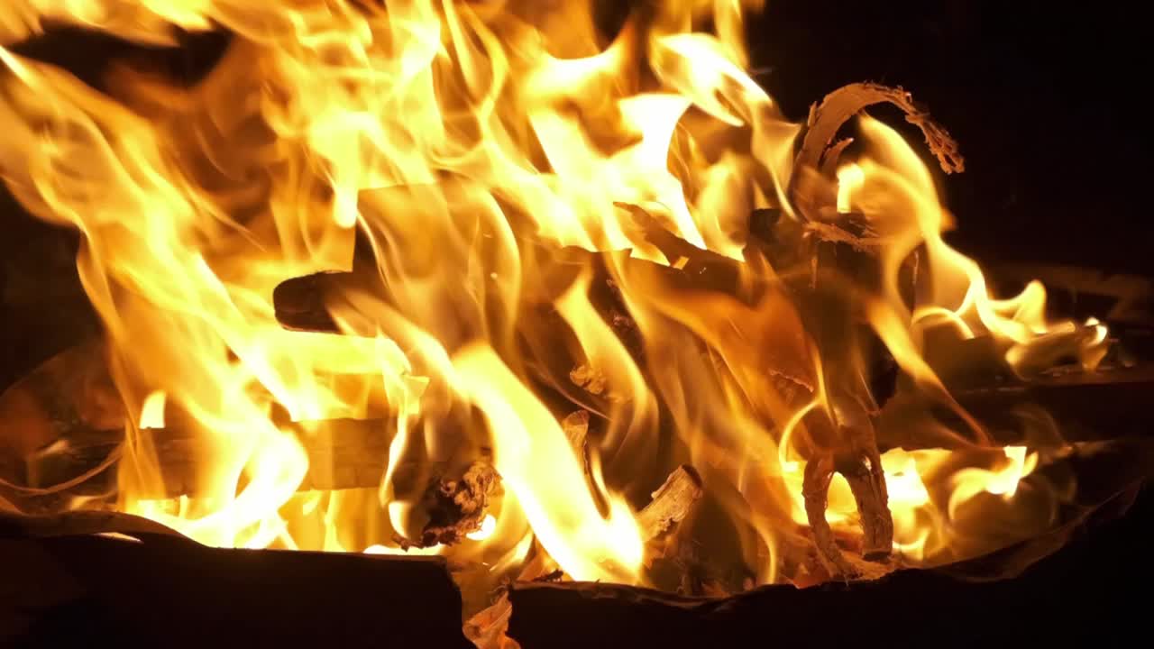 slow motion flames flicker at night