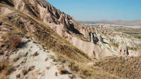 Flying-over-wild-landscape-of-Cappadocia,-Turkey-wilderness