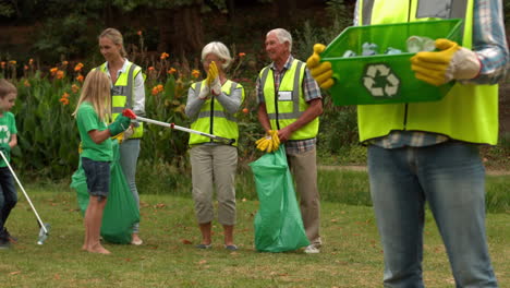 happy family collecting rubbish