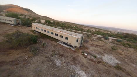 flying over abandoned and rusty trains