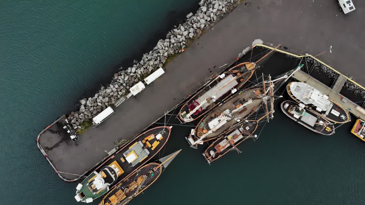 Top down aerial of of boats in the harbour of Sey&eth;isfj&ouml;r&eth;ur, a small town in Iceland