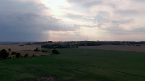 Rising-aerial-showing-Swedish-countryside-at-sunset-in-the-summer