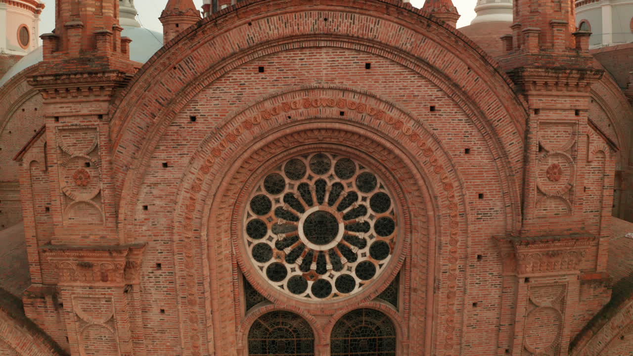 Stunning panoramic view of the historic center of Cuenca, Ecuador, with a focus on the majestic blue domes of the Cathedral of the Immaculate Conception.