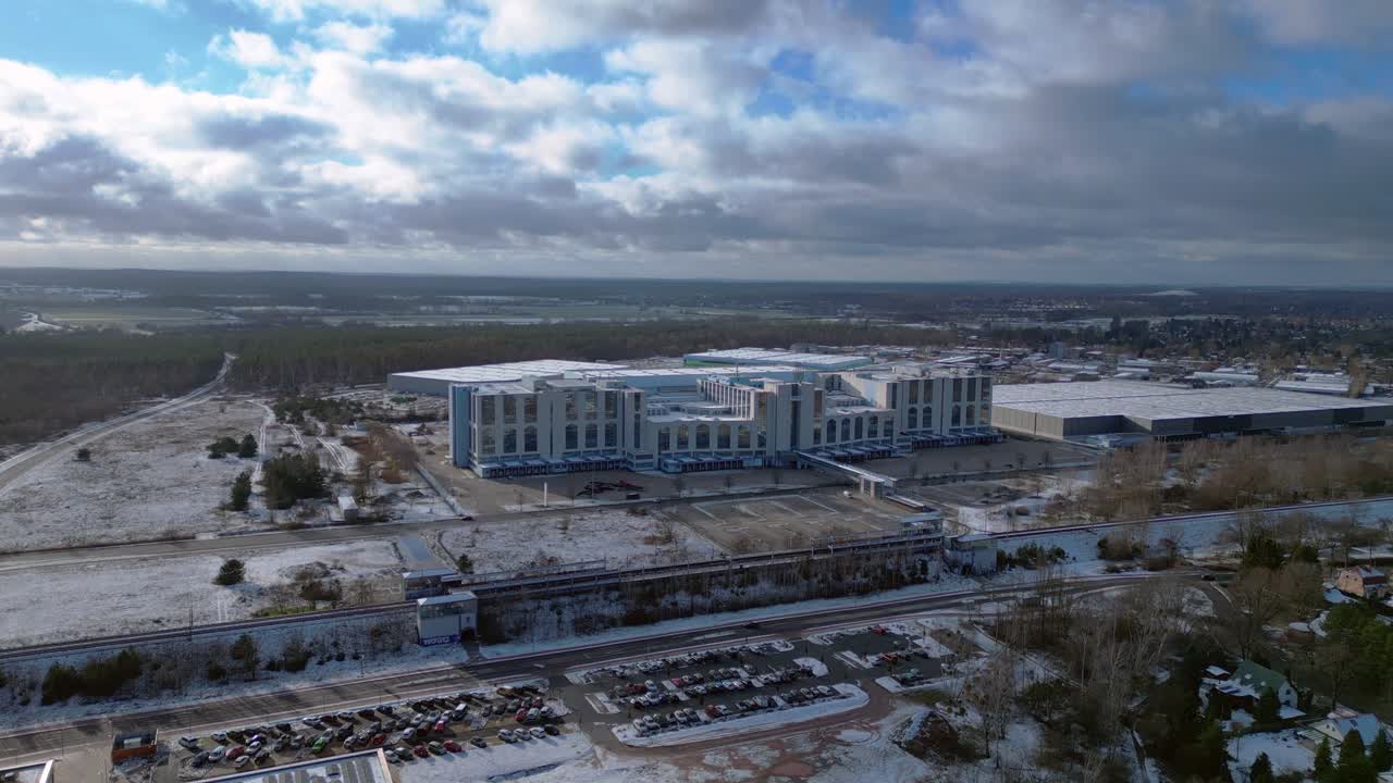train traveling through a snowy cityscape in segefeld Falkensee. Majestic aerial view flight panorama overview drone