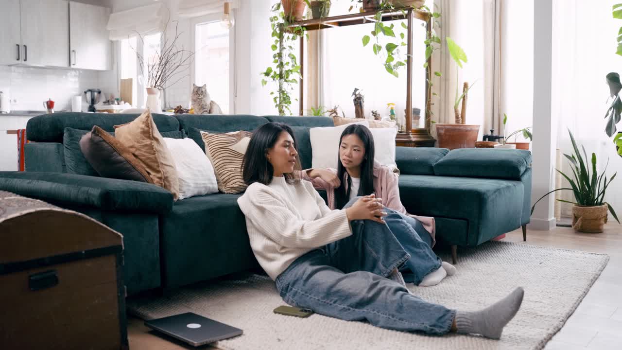 Mother and Daughter Having a Relaxed Conversation at Home