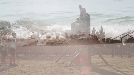 children playing on playground equipment with ocean waves overlay animation