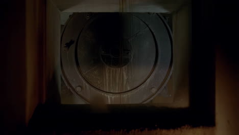 industrial machinery spinning in a dark enclosed space