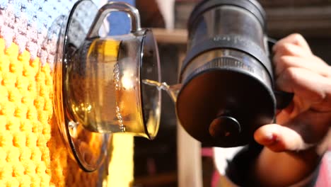 pouring tea from a french press
