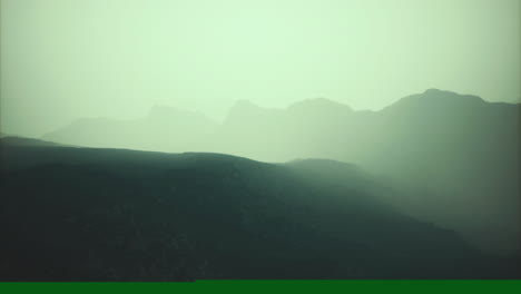 Serene mountain landscape in soft light at dawn reflecting natural beauty