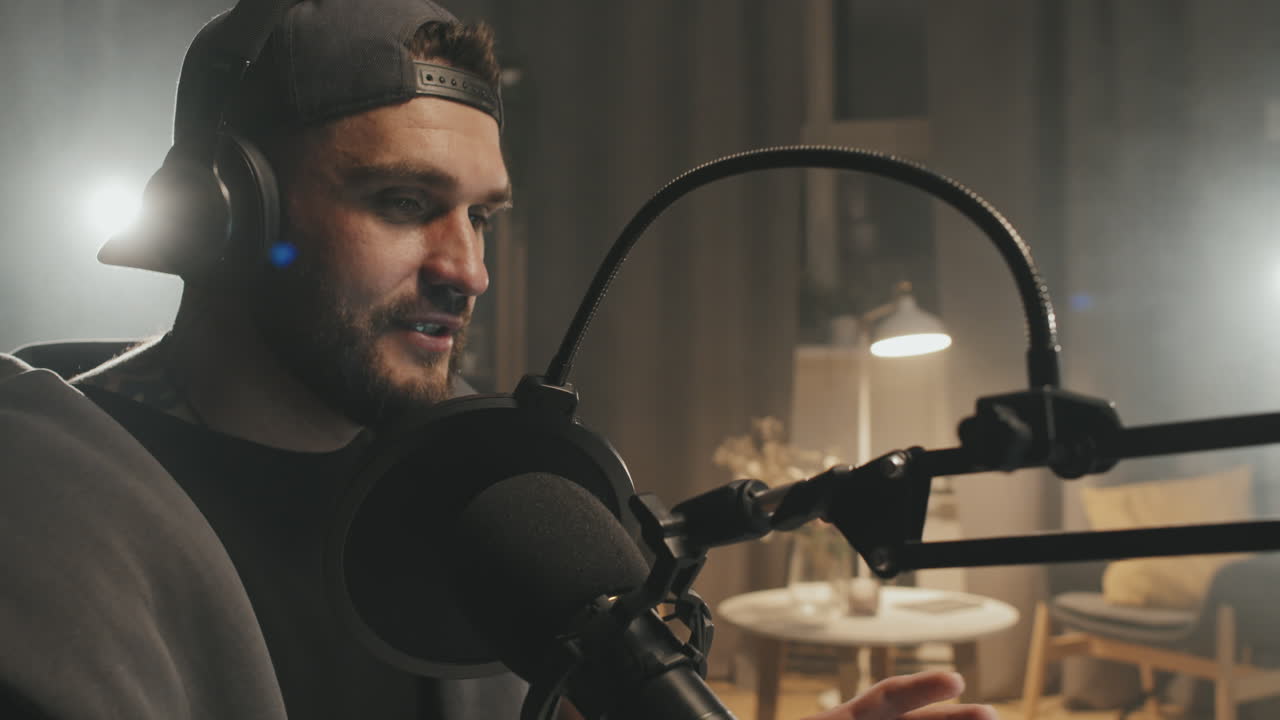 Podcast Host Talking Into Microphone at Home