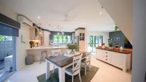 stylish open-plan kitchen and loungeroom in a contemporary townhouse, featuring modern appliances. interior of house home staged for real estate.