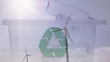 animación de una caja verde de reciclaje con cajas de plástico y turbinas eólicas