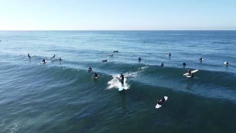 surfer catching wave in encinitas