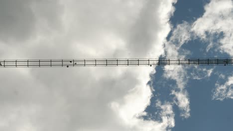 vertical view of blackforestline bridge with people on sunny day