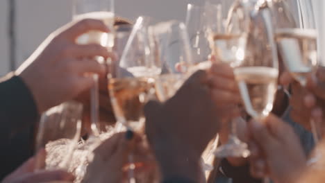 happy group of friends making toast drinking alcohol celebrating rooftop party young women taking photo together enjoying reunion celebration on weekend social gathering at sunset