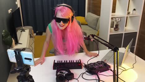 woman streaming music production in home studio