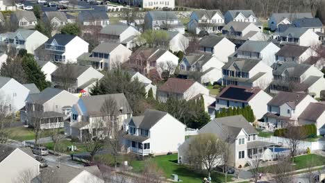 aerial zoom shot: new developed single family homes at sunny day