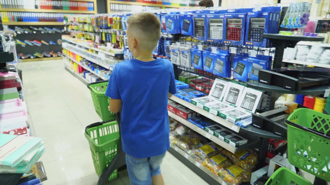 VINNITSA, UKRAINE - AUGUST 20, 2018: Buying school supplies at the supermarket. School goods in the store.