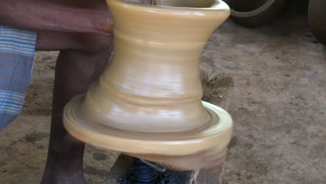 hands of a potter manufactured a pot of clay - 4k