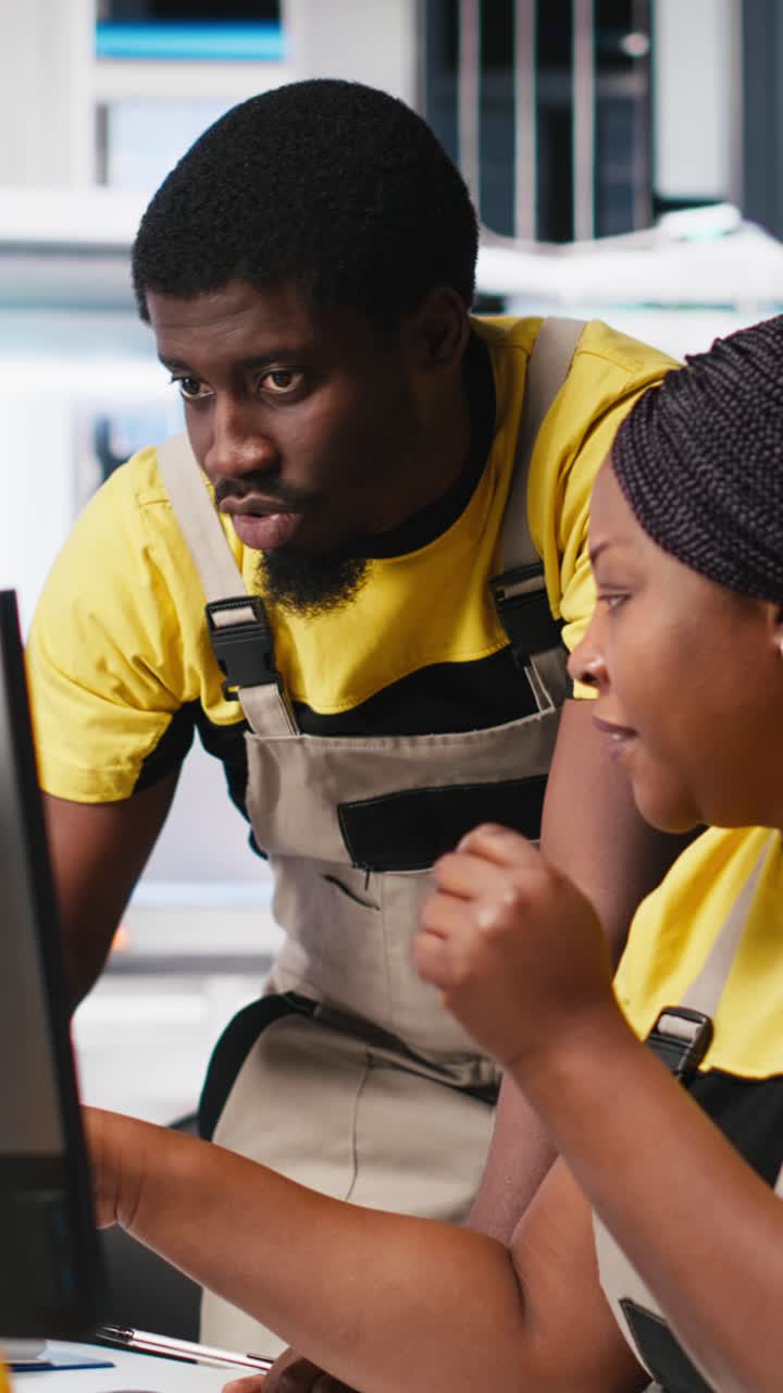 Vertical Video Black engineering team working at a high tech solar panel factory