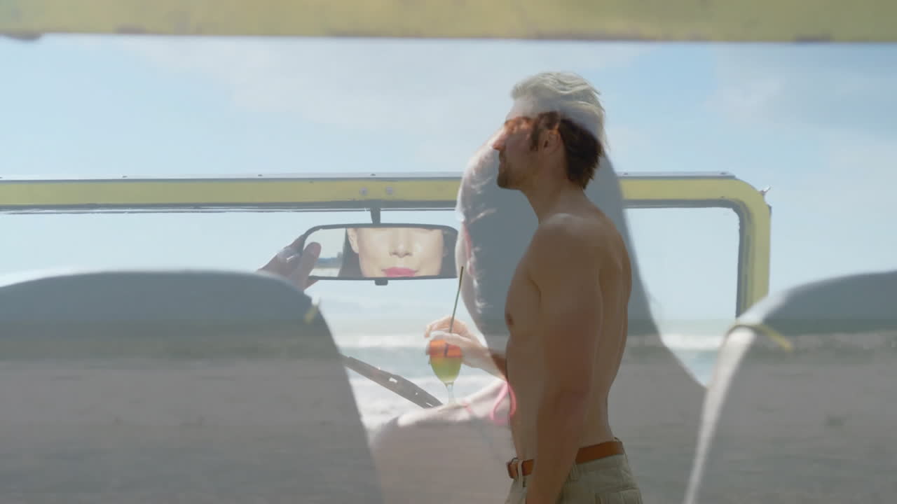 Standing on beach, shirtless man with animation overlay of woman in car mirror